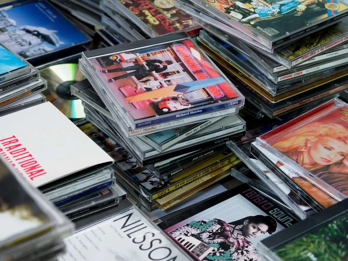 Stacks of CD albums representing the many music promotion options available to independent artists
