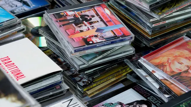 Stacks of CD albums representing music promotion options